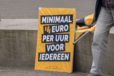 Low section of man standing on street