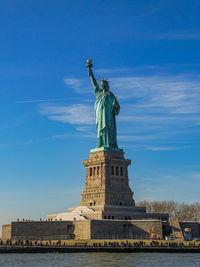 Low angle view of statue against sky