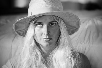 Portrait of young woman in hat