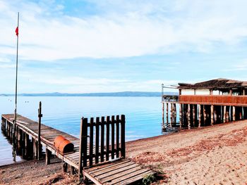 Pier over sea against sky