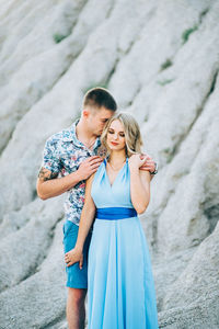 Happy couple standing outdoors