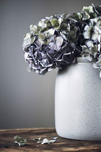 Close-up of purple flower vase on table