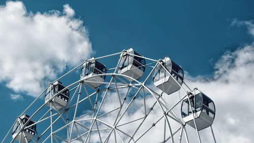 Low angle view of ferris wheel against sky