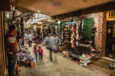 People walking at market stall in city