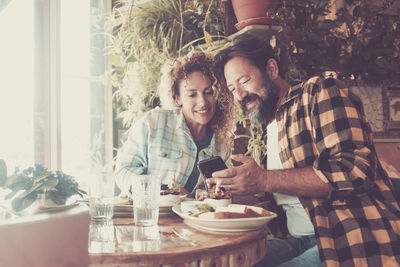 Young couple sitting at table