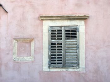 Closed window on wall