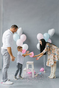 Gender reveal party. stylish beautiful family with a child found out the gender of the future family