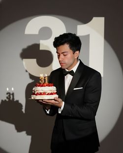 Portrait of businessman holding bouquet