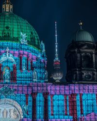 Illuminated buildings in city at night