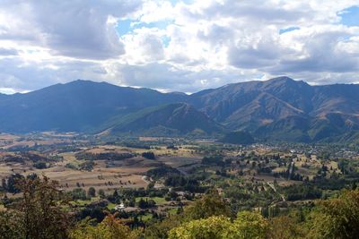 Aerial view of townscape against mountains