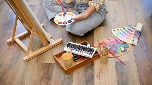 High angle view of boy playing on table