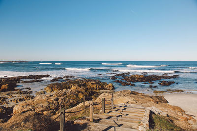 Scenic view of sea against clear blue sky