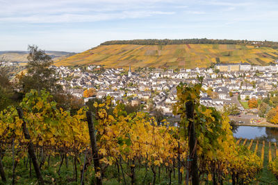 Panoramic view of townscape against sky during autumn