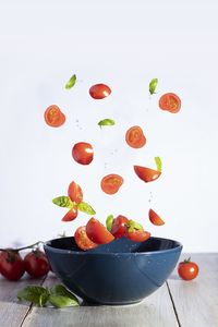 Close-up of fruits on table against white background