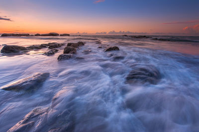 Scenic view of sea against sky during sunset