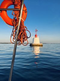 Sailboat sailing on sea against sky