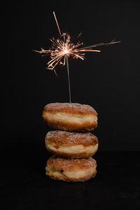 Close-up of firework display over black background