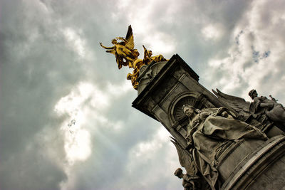 Low angle view of statue against sky