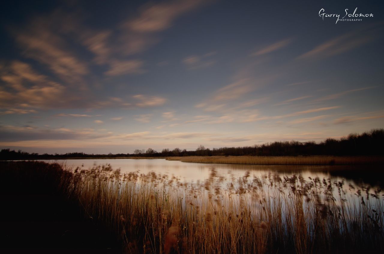 SCENIC VIEW OF LAKE DURING SUNSET