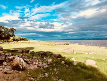 Scenic view of beach against sky