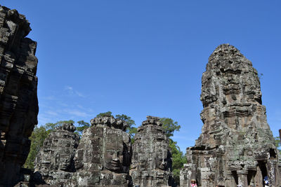 Low angle view of historical building against clear blue sky