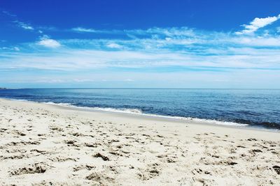 Scenic view of sea against blue sky