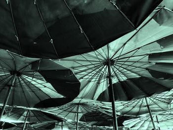 Low angle view of umbrellas on roof