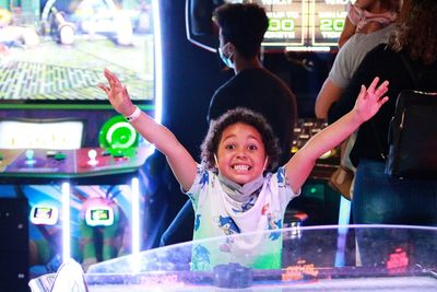 High angle view of cute girl playing with dog