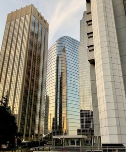 Low angle view of modern buildings against sky