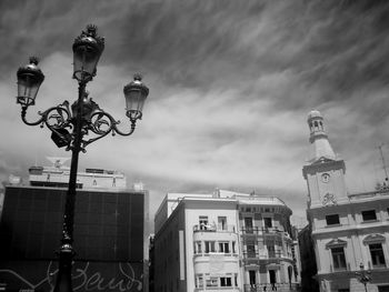 Low angle view of building against cloudy sky