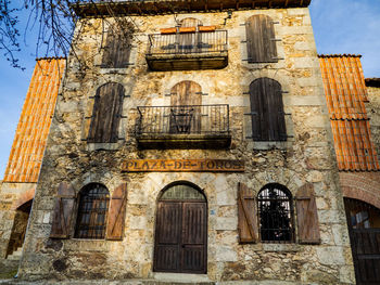 Low angle view of old building against sky