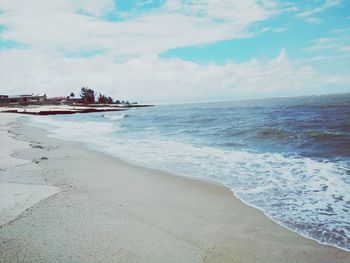 Scenic view of beach against sky