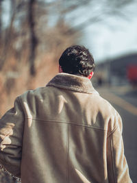 Rear view of man standing outdoors