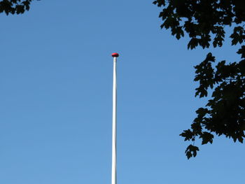Low angle view of street light against clear blue sky