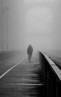 Full length of woman walking on road