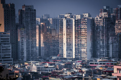 Aerial view of modern buildings in city against sky