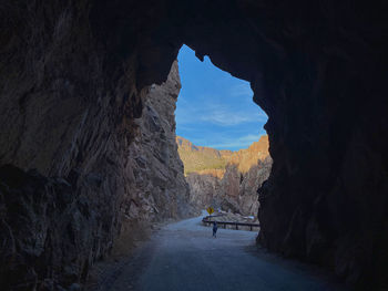 Boy walking on mountain road