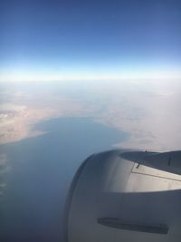 Aerial view of cloudscape over airplane wing