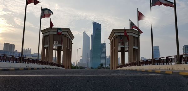 View of city buildings against cloudy sky