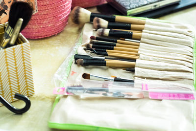 High angle view of make-up brushes on table