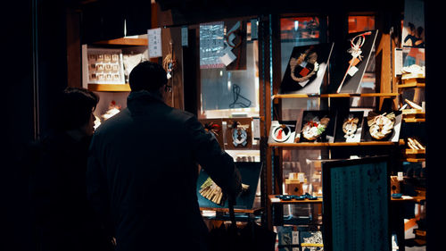 Rear view of man standing in restaurant