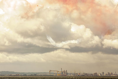 Smoke stacks against sky