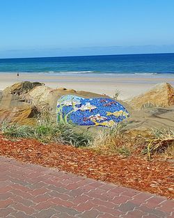 Scenic view of sea against blue sky