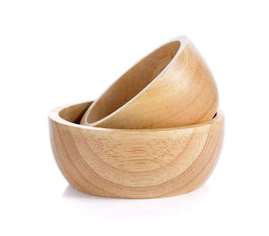 Close-up of bread in bowl against white background