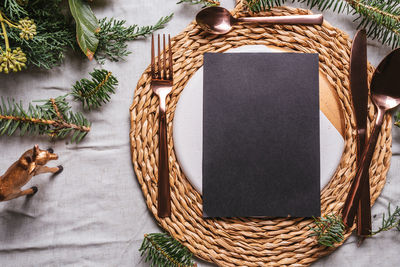 Directly above shot of blank paper by christmas decoration on table