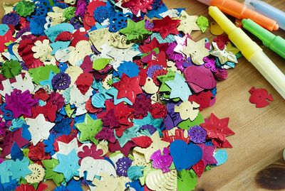 High angle view of multi colored paper on table