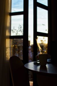 Close-up of window on table at home