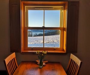 Chairs and table by window at home