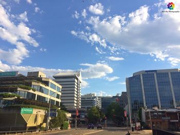 City street against cloudy sky