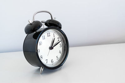 Close-up of clock against white background